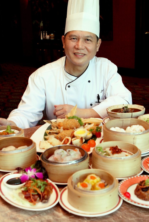 Dim Sum chef Low Kim Ong with his array of dim sum favourites served at the restaurant. 
