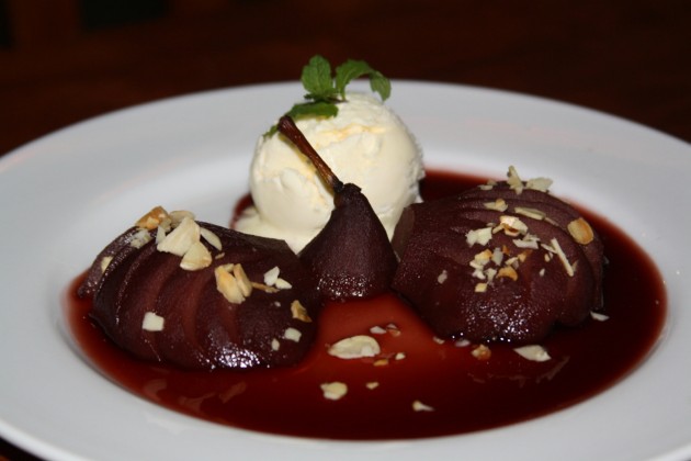 The mouth-watering Red Wine Poached Pear with Homemade Vanilla Ice Cream and Almond Flakes.
