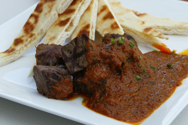 Grilled beef tenderloin with rendang sauceserved with Mission Naan