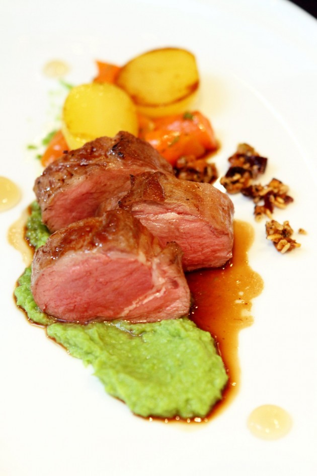 Pan Seared Loin of Lamb with sous vide potatoes, vichy carrots, mint jelly and pan sauce.