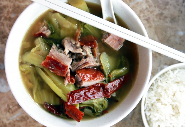Tangy veggie: A bowl of the appetising Hot and Spicy Vegetable to balance out the meaty affair.