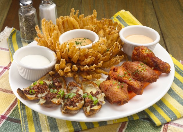 Awesome Threesome, featuring Morganfield's most famous appetisers: Onion Blossom, Spicy Chicken Wings and Russet Potato Skins.