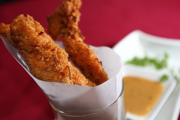 Coconut chicken strips with honey soya dipping sauce.