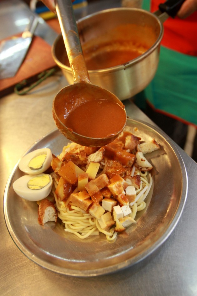 Gani Seeni Mohammad does not skimp on sauce and ingredients when serving his customers his special Penang mee rebus.