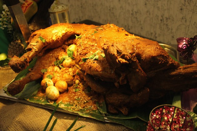 The aromatic Lamb Kuzi is cooked with rich herbs and spices and served with beriani rice.