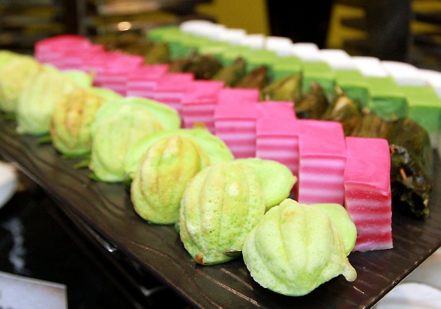 An assortment of traditional Malay cakes such as kuih bakar to kuih lapis at the the dessert station.