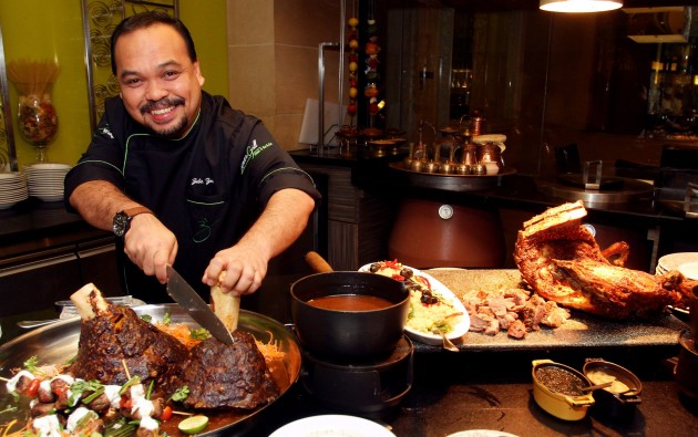 Chef Zubir Md Zain carves the day's special at Latest Recipe, Beef Minced Shank. 