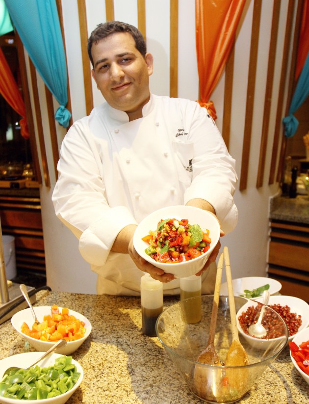 Chef Youssef Issa with the Pomegranate Walnut Salad.