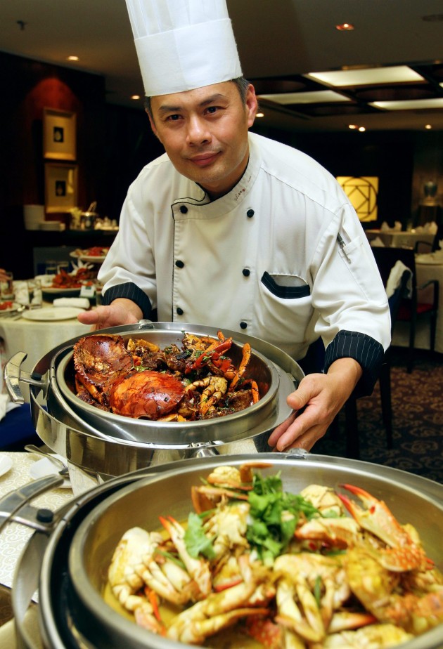 Executive chef Gary Lim showing off the Wok-fried Crab in Marmite Sauce.