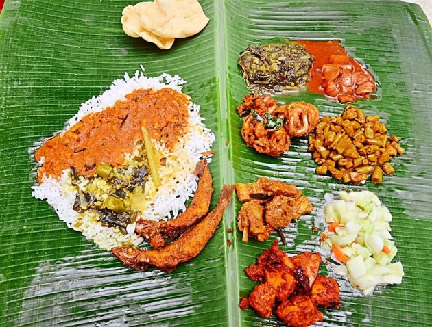 Rice is served with a variety of vegetable dishes and papadam on the side at Sri Ganapathi Mess in Old Town, Petaling Jaya.