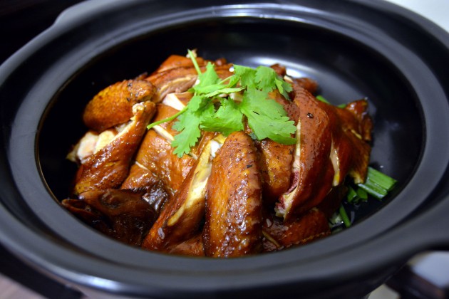 Succulent speciality chicken served in a clay pot.