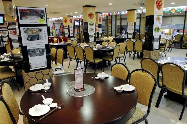 The restaurant features a typical Chinese food establishment decor and feel.