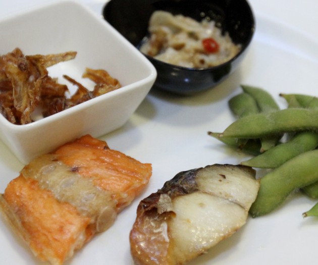 A selection of (from left) Salmon Shioyaki,Tazukuri, marinated Scallop Lips, Edamame, and Saba Shioyaki.