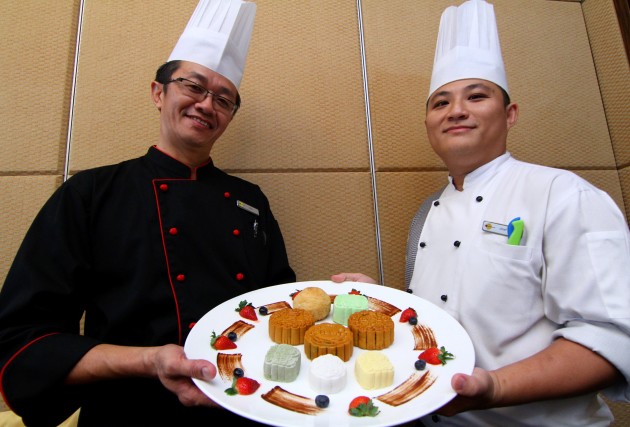Chan and dim sum chefJordon Chin showing some of the restaurant’s specially prepared mooncakes for the Mid-Autumn Festival.