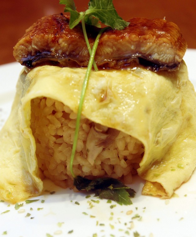 Unagi and mushroom rice wrapped in egg with honey teriyaki glaze.