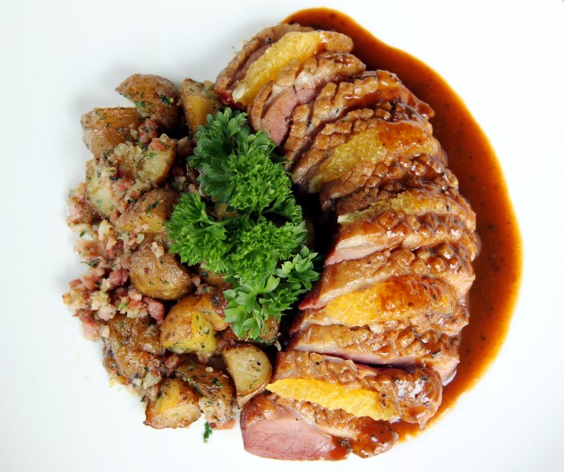 The Balsamic Glazed Smoked Duck  Breast, with potato and pork bacon  on the side. 
