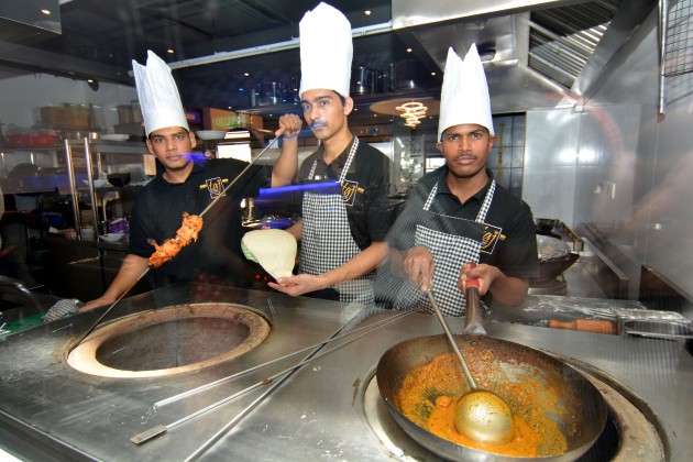 Biryani specialist Chef Rehman Sharieff, Tandoor specialist Chef Pavan Singh and South Indian curry specialist Chef Muthukrishnan in action at Taj Biryani House.