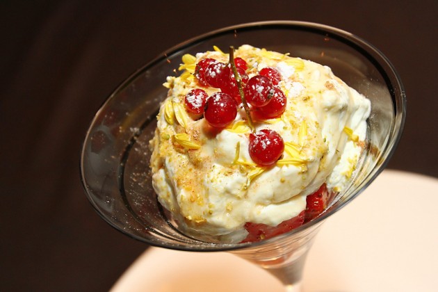 Strawberry Romanoff is made out of whipped cream, fresh strawberries and topped with mashed nuts.