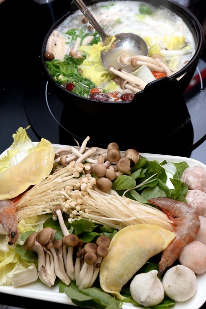 Just like any steamboat, you can order straw mushrooms, seafood like fresh prawns, and meat slices.