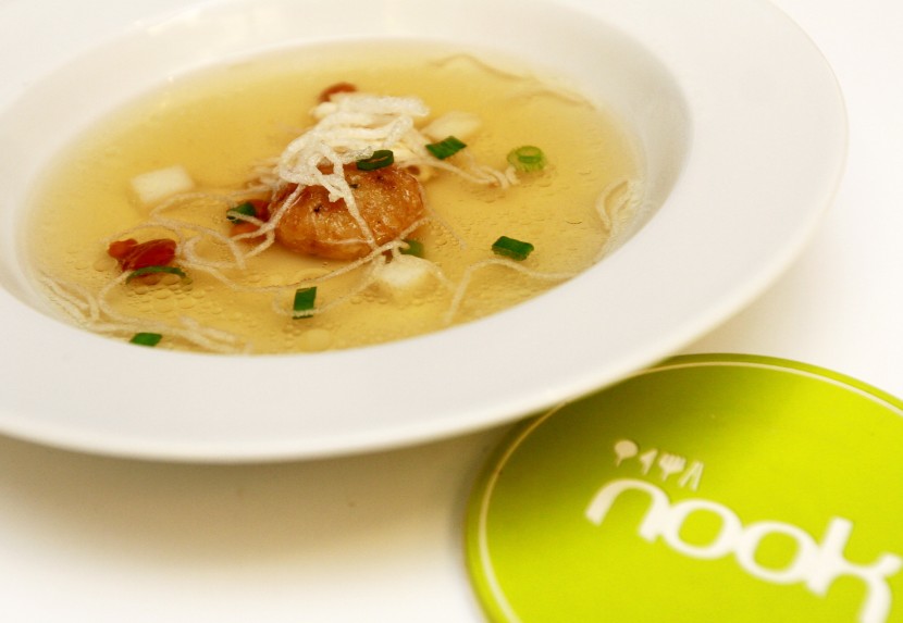 Creamy goodness: The Indonesia-inspired Chicken Soto Consomme is a light pale yellow chicken with buttery bergedel.