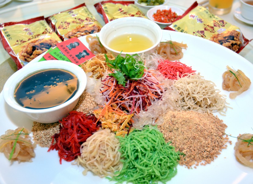 Lunar New Year staple: The Prosperous Live Grass Yee Sang comes with plum sauce.
