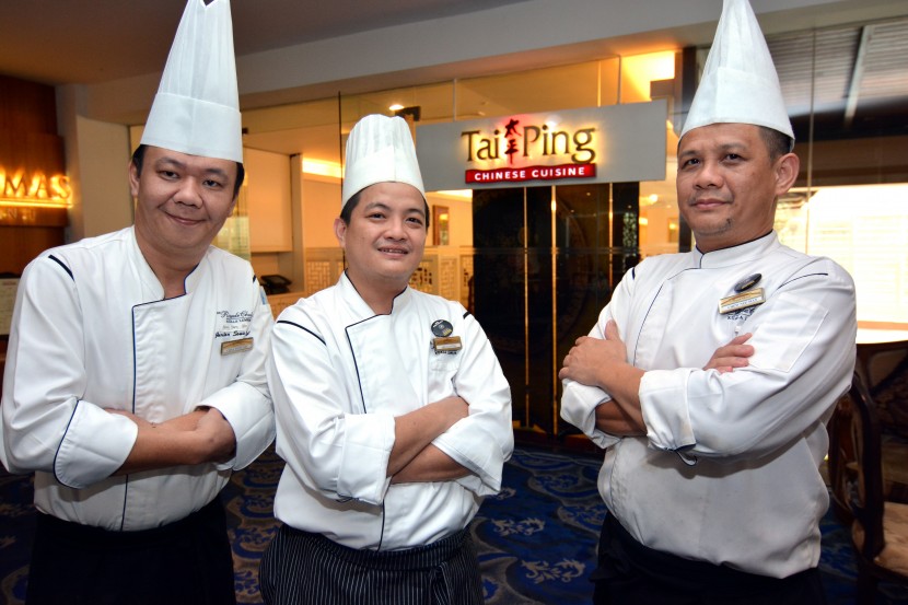 The team: (From left) Junior sous chef Chan Yong Sin, chef de cuisine Lee Sai Ying and Chinese chef Chew outside Tai Ping Restaurant.  