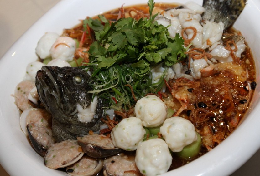 Steamed ocean garoupa fish with king prawns, stuffed clams, squid balls and 'Seng kwa'.