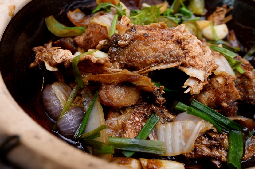 Inviting dish: The claypot fish head in soy sauce.