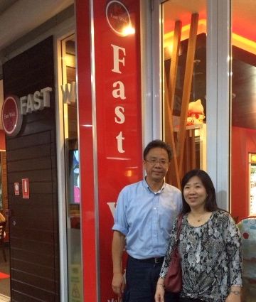Chen and his wife, Amy Leong, outside their favourite restaurant Fast Wok in Gold Coast, Australia.