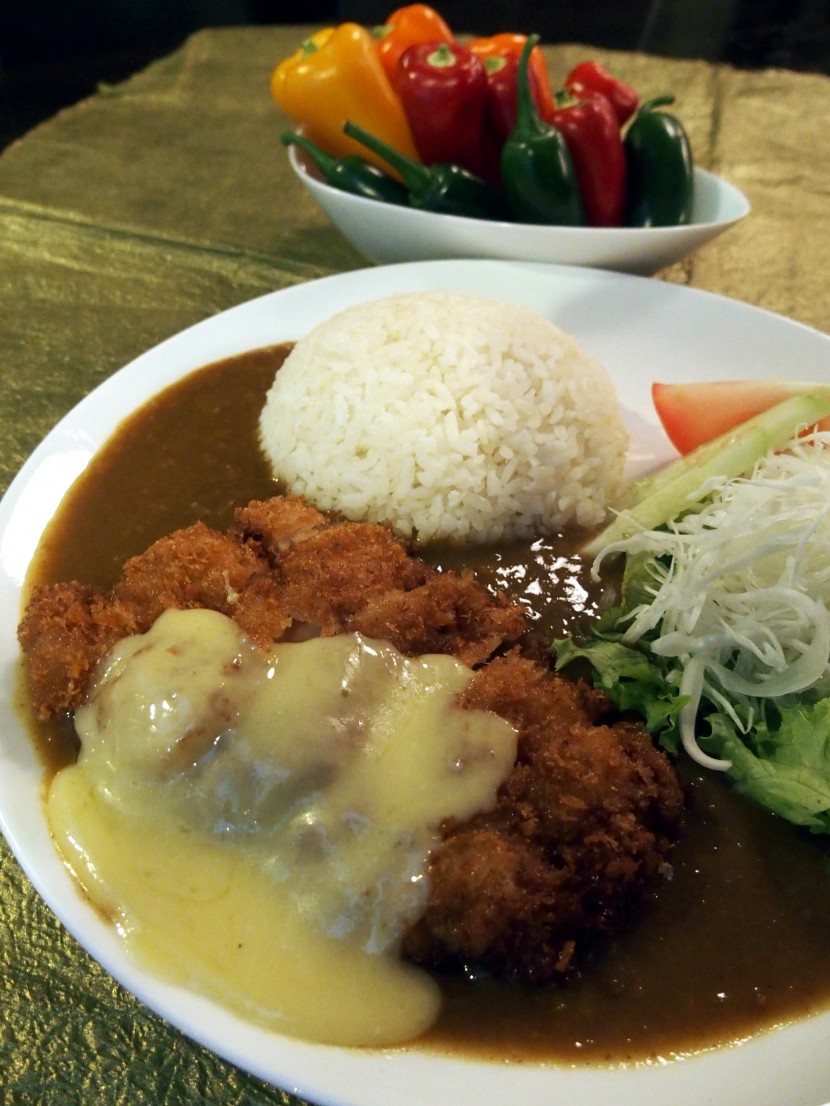 Satisfying dish: Chicken Katsu Curry Rice topped with melted cheese.