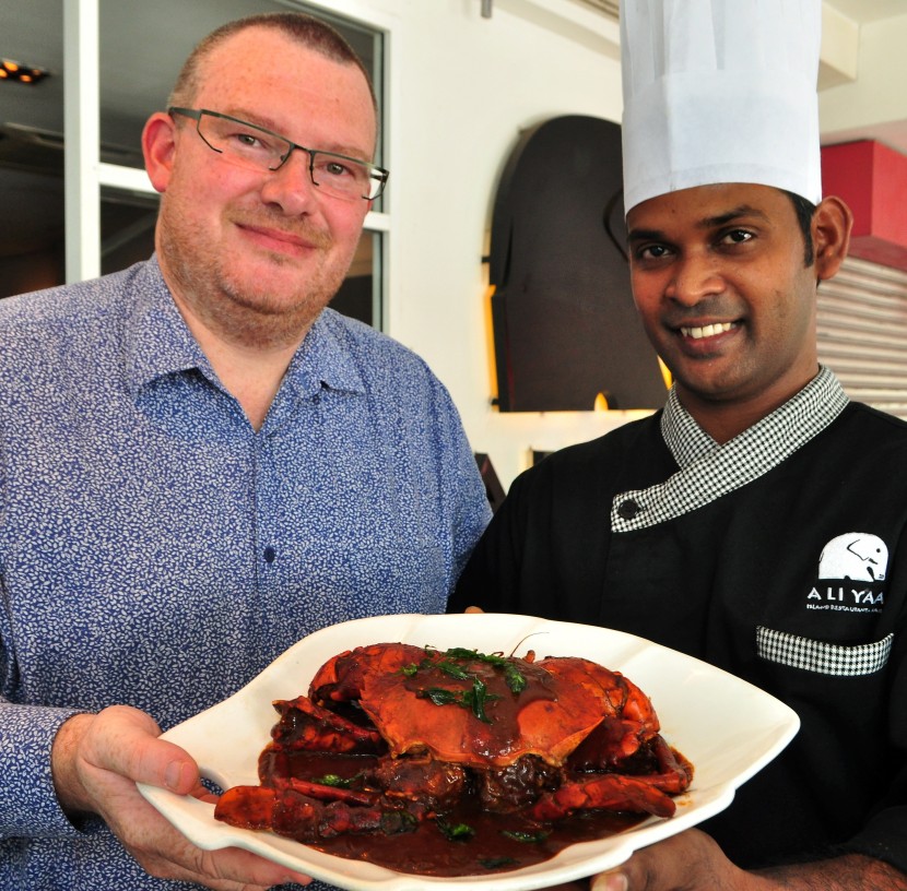 Selby and Chef Pradeep Kumar showing off the house specialty - Sri Lankan crab.