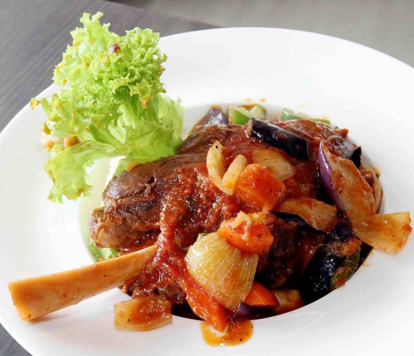The Tuscan lamb shank is accompanied by well-seasoned ratatouille and creamy mashed potatoes.