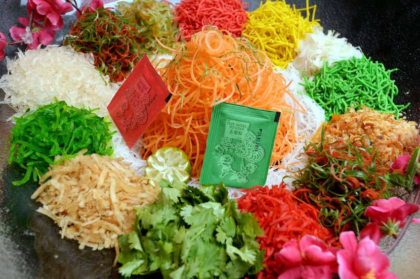 “Yin Yang” prosperity Yee Sang is served with Norwegian salmon and Japan's yellow fin tuna slices. 