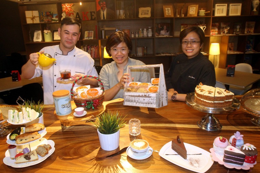 Hew (centre), flanked by Heng (left) and Yeong, are seen here at Madeleine Bistro, one of the F&B ventures under the group.