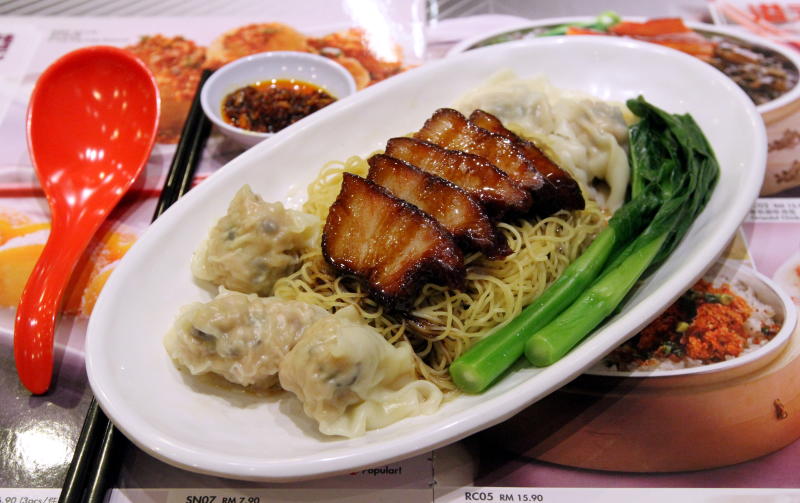 Signature dish-Hong Kong noodles with pork char siew and dumplings, freshly roasted and wrapped in-house.