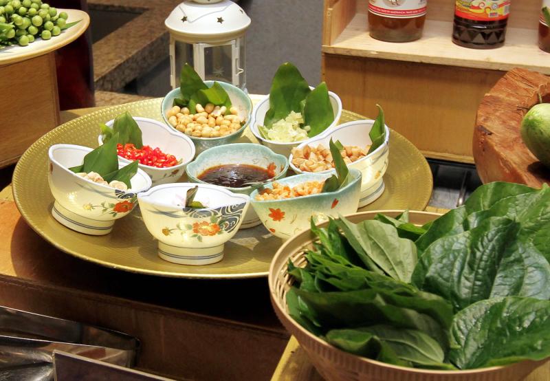 Some Thai favourites to look out for is the Traditional Wrapped Betel Leaves with Condiments (Miang Kham).