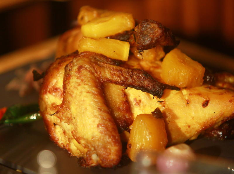 The Ayam Percik Pantai Timur (Grilled chicken in turmeric coconut sauce and pineapple) was well-marinated.