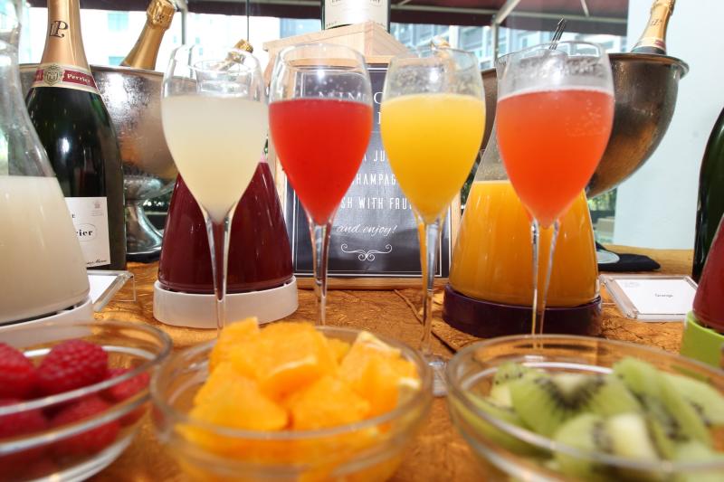 The Make-Your-Own-Mimosa bar allows guests to pick juices that are then mixed with Laurent-Perrier Brut champagne.